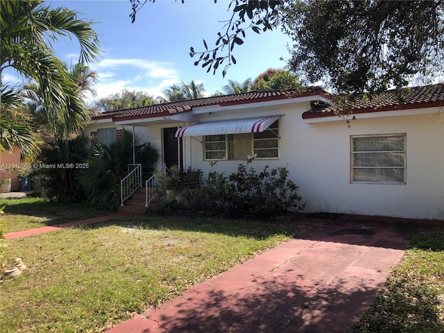 1256 NE 149th St, Miami, FL 33161 - mediterranean / spanish home with stucco siding and a front yard