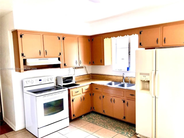 1256 NE 149th St, Miami, FL 33161 - kitchen featuring white appliances, under cabinet range hood, a sink, light countertops, and light tile patterned floors