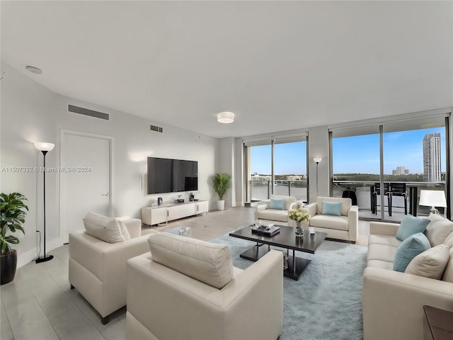 living room featuring light hardwood / wood-style floors and expansive windows