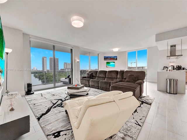 living room with expansive windows and light tile floors