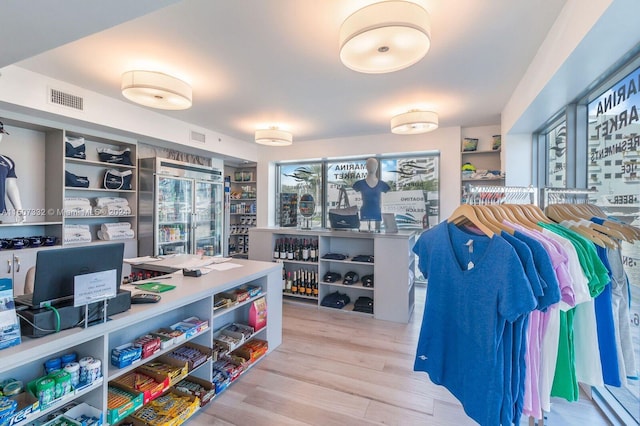 spacious closet with hardwood / wood-style flooring