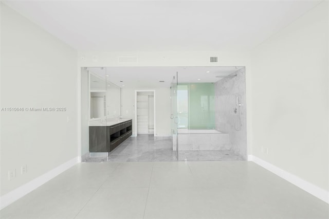 bathroom featuring vanity, tile patterned flooring, and separate shower and tub