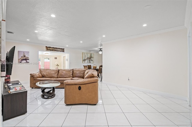 tiled living room featuring a textured ceiling, crown molding, and ceiling fan