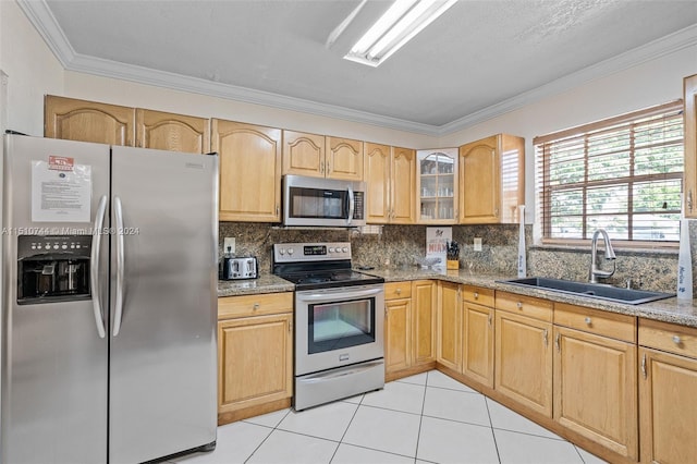 kitchen featuring light tile patterned floors, stainless steel appliances, light stone countertops, decorative backsplash, and sink