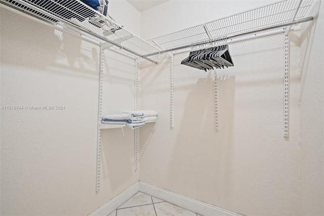 spacious closet with light tile patterned flooring