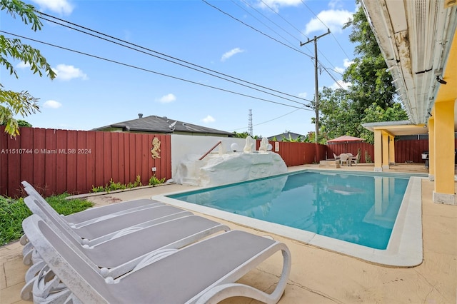 view of swimming pool featuring a patio