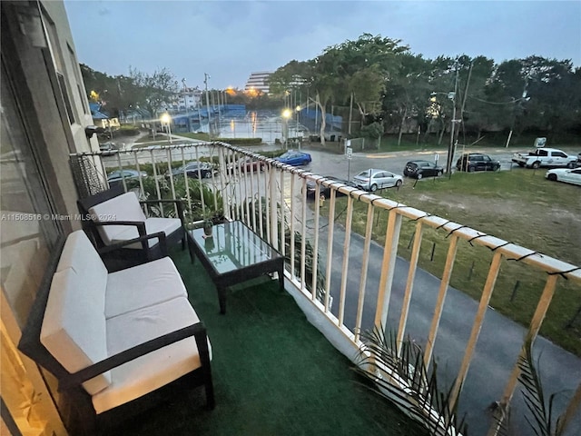 view of balcony at dusk