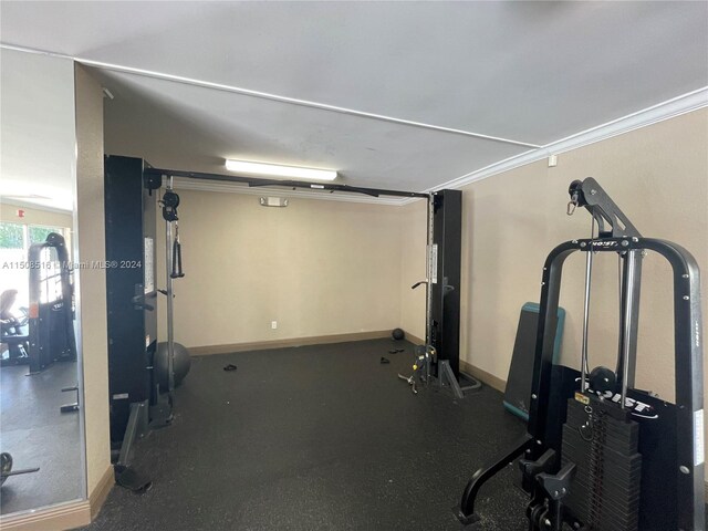 exercise room with ornamental molding