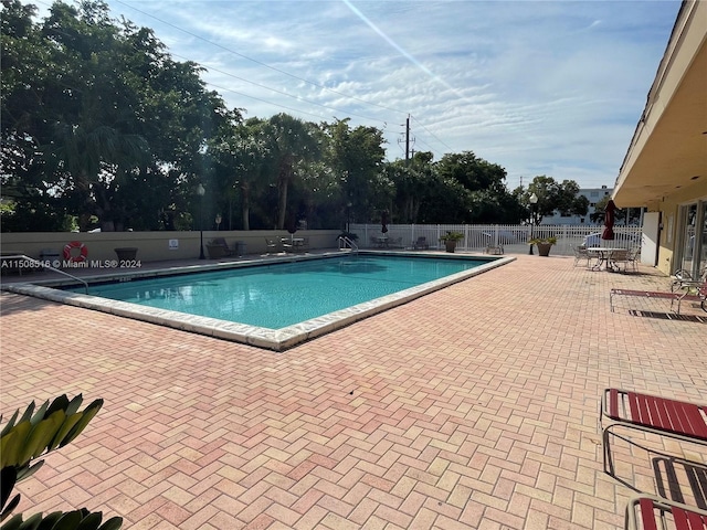 view of pool featuring a patio area