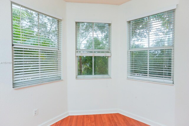 2150 Shoma Dr Unit 226, Royal Palm Beach, FL 33414 - spare room with wood finished floors, baseboards, and plenty of natural light