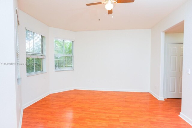 2150 Shoma Dr Unit 226, Royal Palm Beach, FL 33414 - empty room with light wood finished floors, ceiling fan, and baseboards