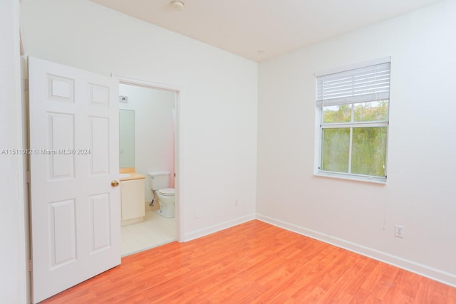 spare room featuring hardwood / wood-style floors