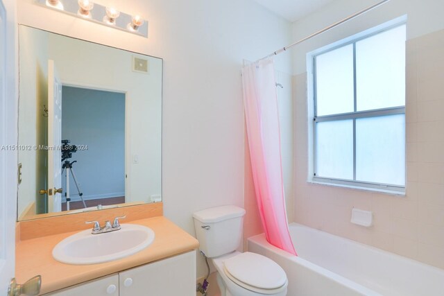 2150 Shoma Dr Unit 226, Royal Palm Beach, FL 33414 - bathroom featuring plenty of natural light, toilet, shower / bath combo with shower curtain, and vanity