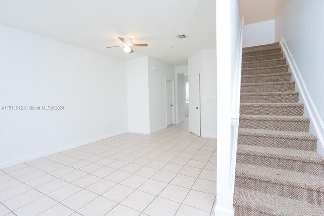 2150 Shoma Dr Unit 226, Royal Palm Beach, FL 33414 - stairs with a ceiling fan, tile patterned flooring, and baseboards