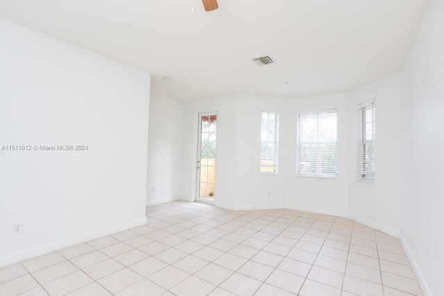 2150 Shoma Dr Unit 226, Royal Palm Beach, FL 33414 - unfurnished room with ceiling fan, baseboards, and light tile patterned floors