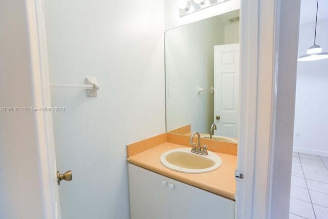 bathroom with tile patterned floors and vanity