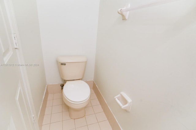 bathroom featuring toilet and tile patterned floors