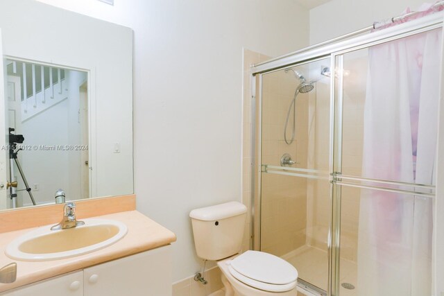 2150 Shoma Dr Unit 226, Royal Palm Beach, FL 33414 - bathroom with a stall shower, toilet, and vanity