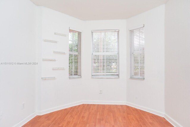 2150 Shoma Dr Unit 226, Royal Palm Beach, FL 33414 - unfurnished room featuring light wood finished floors and baseboards
