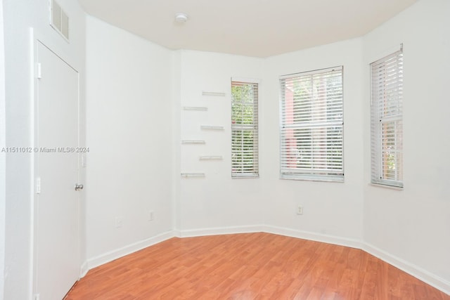 empty room featuring wood-type flooring