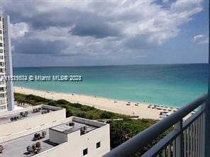 property view of water featuring a beach view