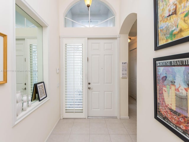 entryway with light tile patterned floors