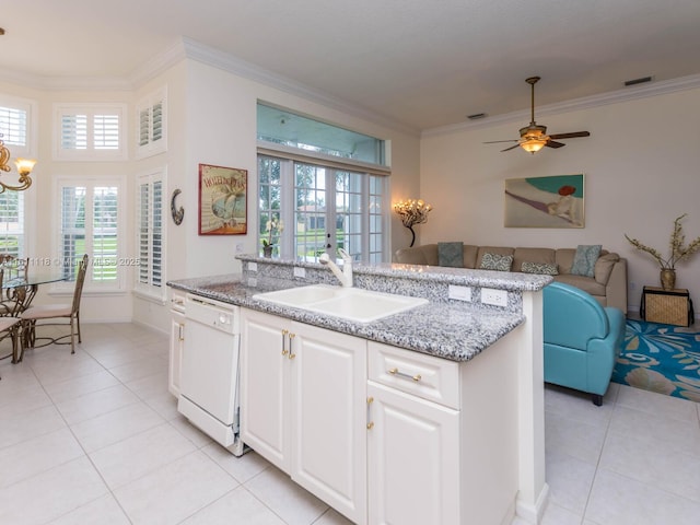 kitchen with sink, french doors, light tile patterned floors, white dishwasher, and white cabinets