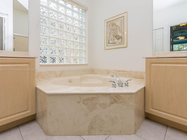 bathroom featuring a washtub and tile patterned floors