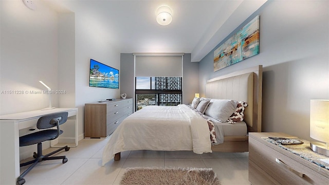 bedroom featuring light tile patterned flooring