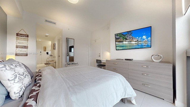 bedroom featuring light tile patterned floors