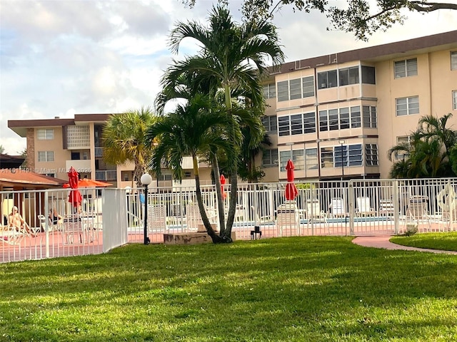 view of community featuring a lawn