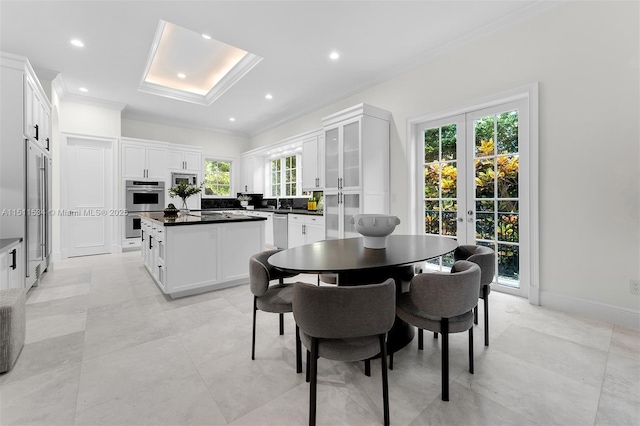 dining area with french doors and ornamental molding