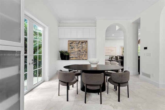 dining area featuring french doors and ornamental molding