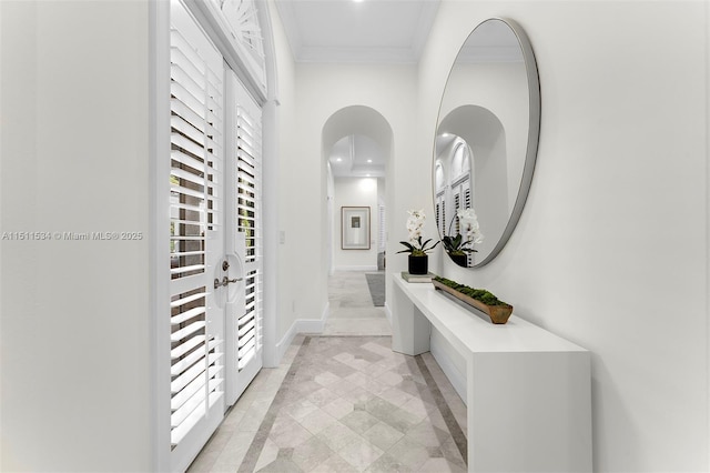 corridor featuring plenty of natural light and crown molding