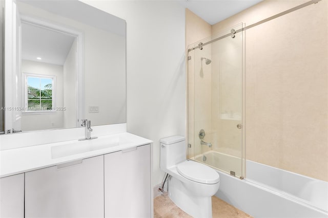 full bath with toilet, bath / shower combo with glass door, and vanity