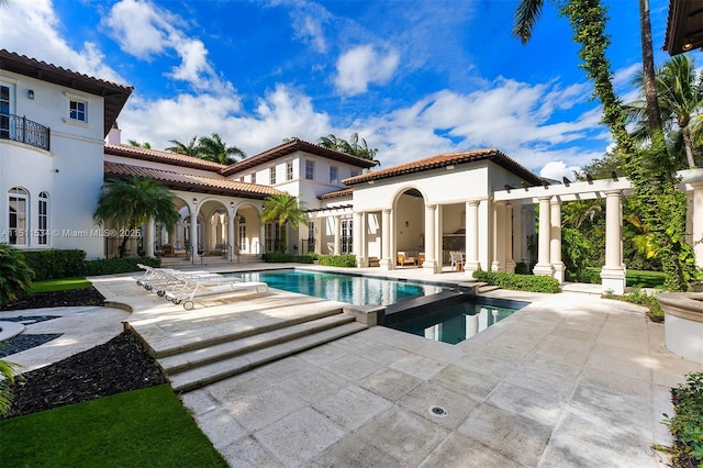 view of swimming pool with a pergola, a patio area, and an in ground hot tub