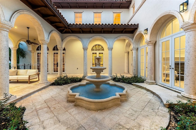 view of patio featuring french doors and ceiling fan