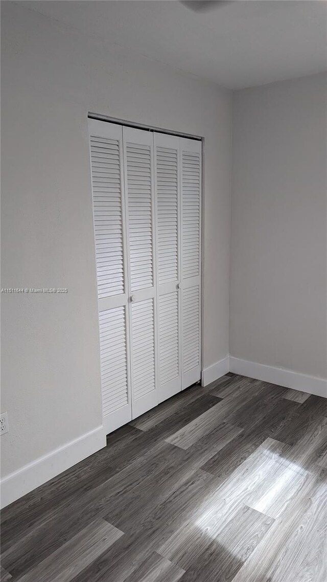 bathroom with a tile shower, vanity, and toilet