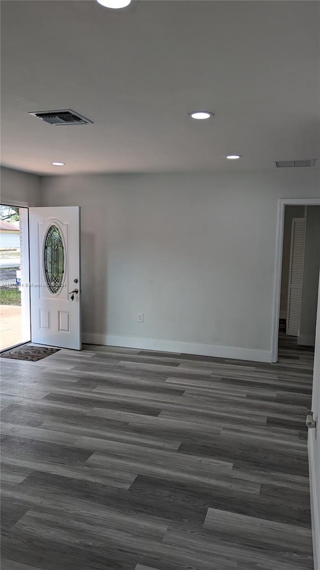 foyer with dark hardwood / wood-style flooring