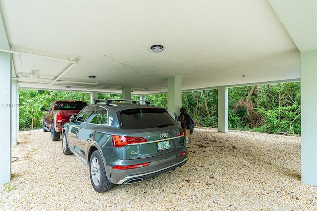 garage featuring a carport