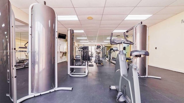 gym featuring a paneled ceiling