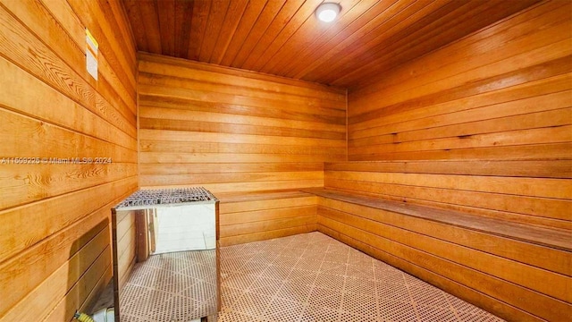 view of sauna featuring wooden walls and wooden ceiling