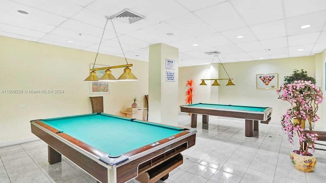 recreation room with light tile floors, a drop ceiling, and pool table