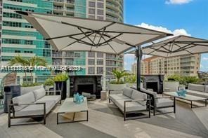 view of patio featuring an outdoor living space with a fireplace