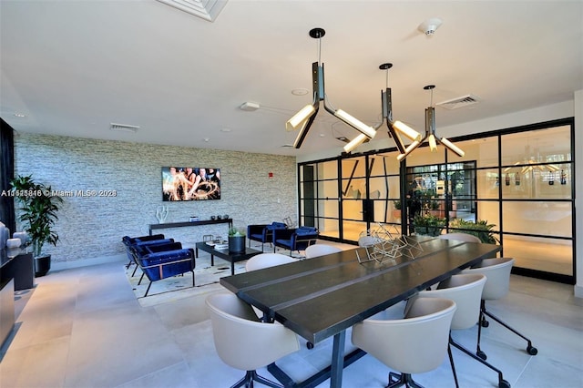 dining area featuring light tile floors