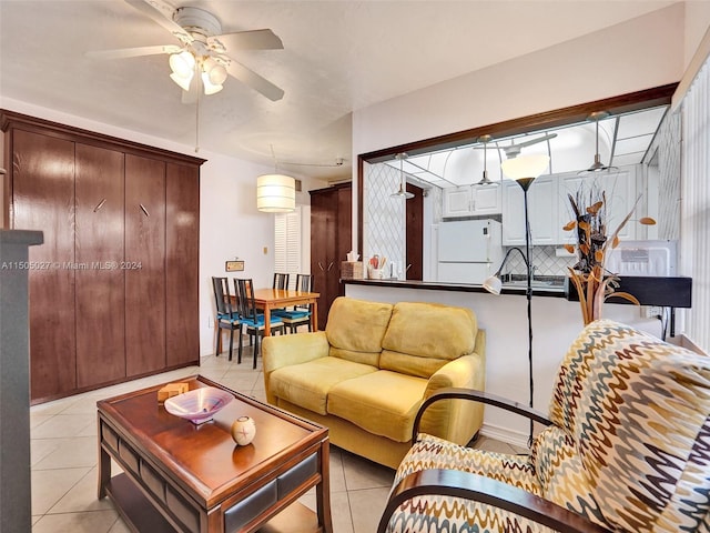 tiled living room featuring ceiling fan