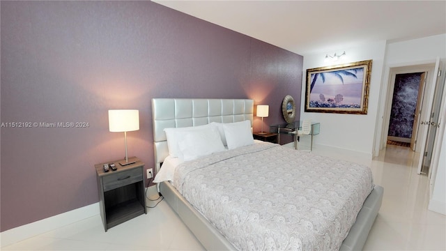 bedroom with light tile flooring