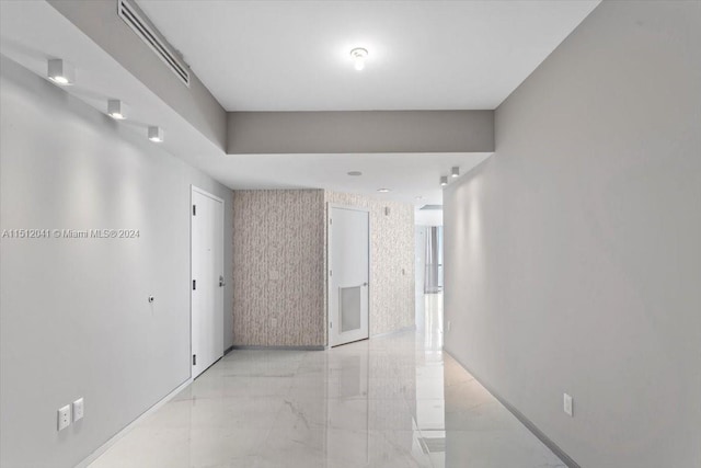 corridor featuring light tile flooring