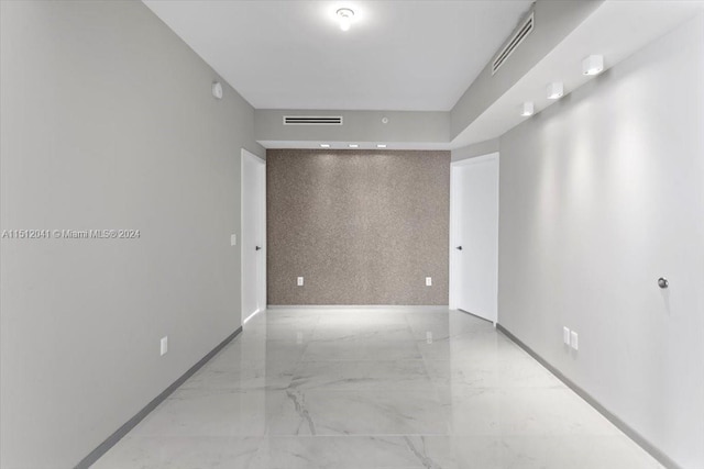 empty room featuring light tile floors