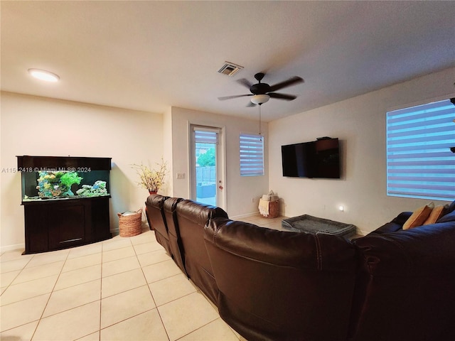 living room with light tile patterned flooring and ceiling fan